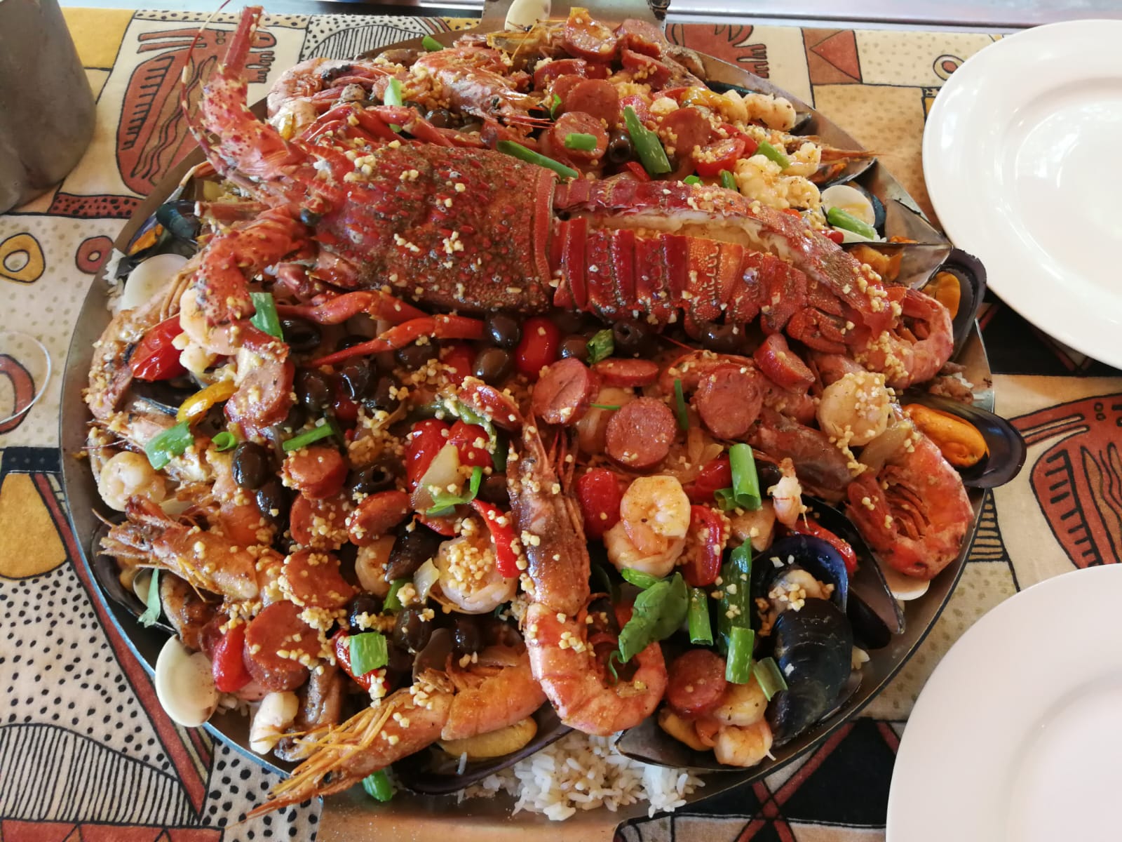 Generous seafood platter served at camp with lobster, prawns, mussels and chorizo.
